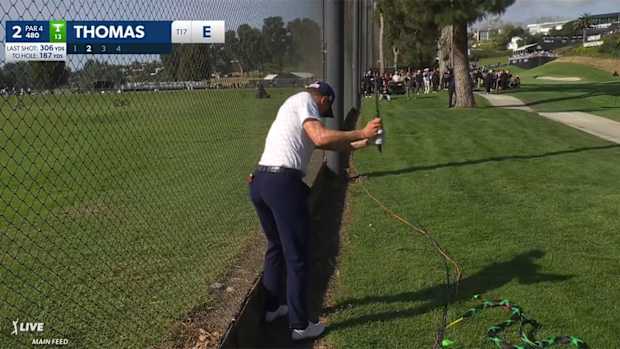Justin Thomas lines up for his second shot on the 2nd hole.